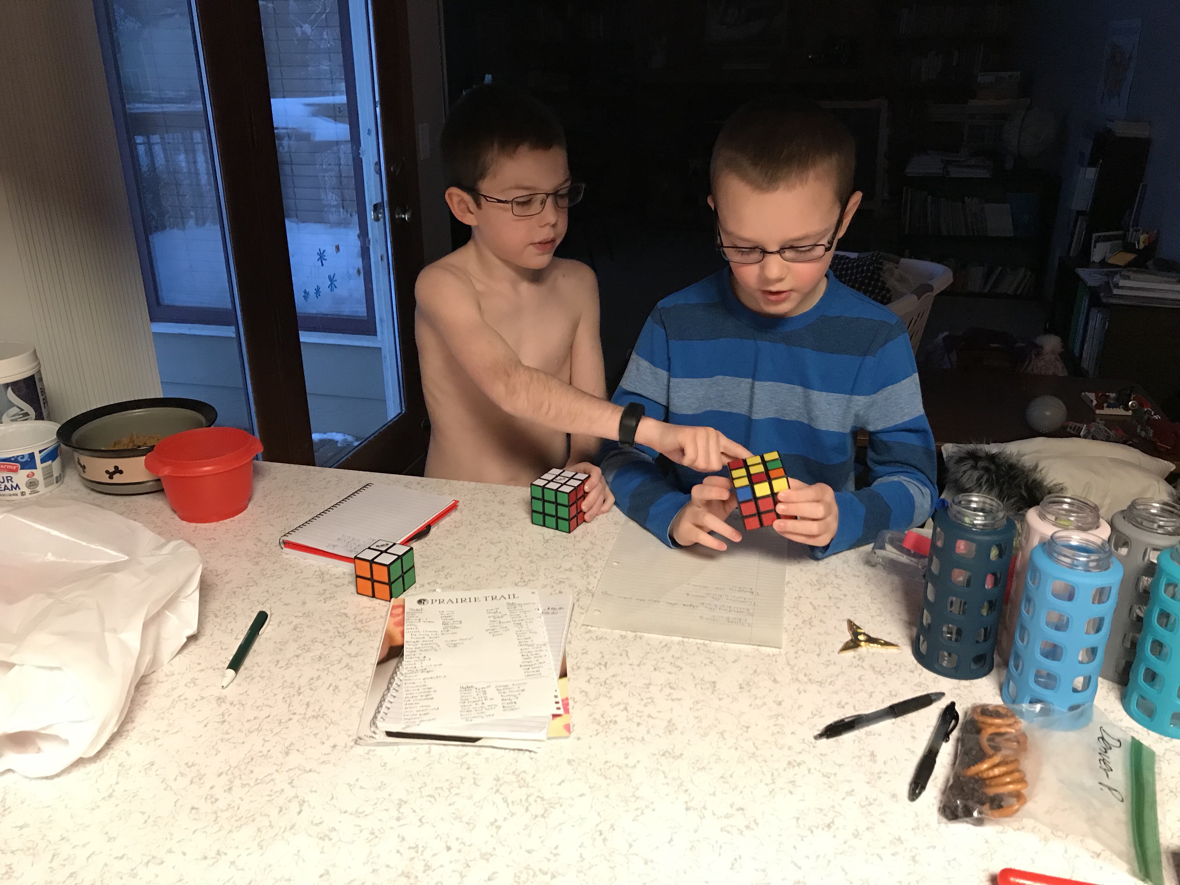 Teaching His Brother Rubix Cube